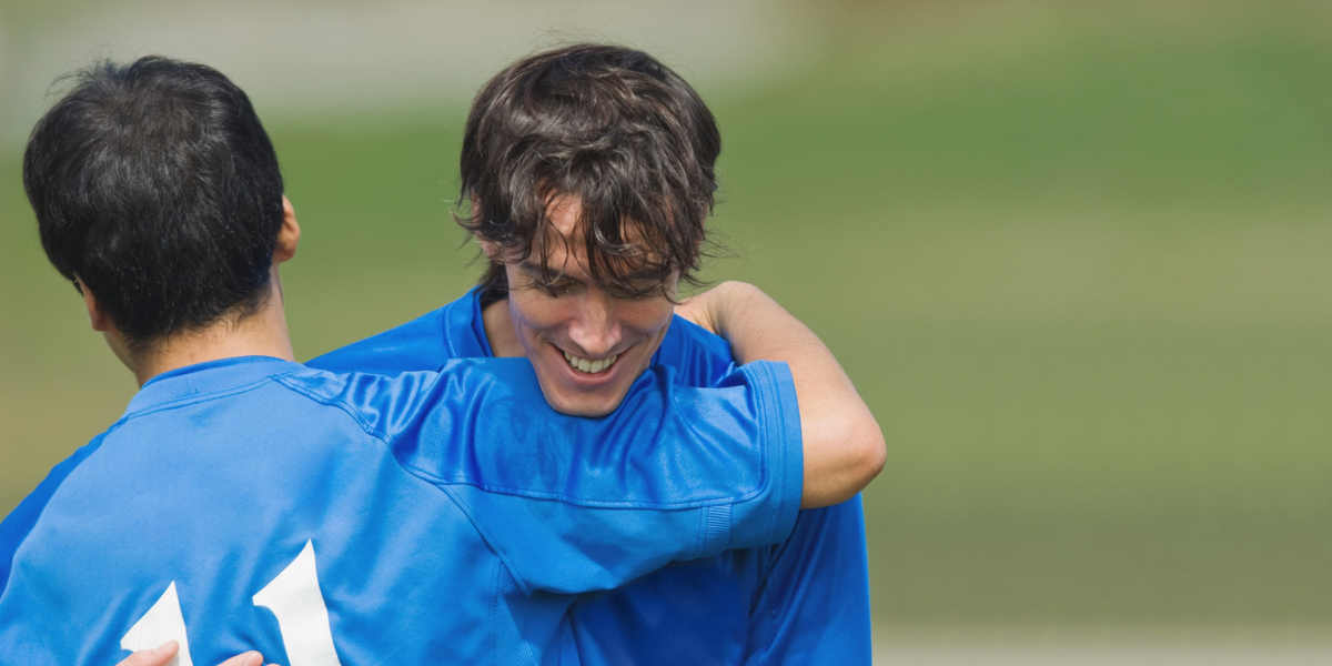 Young footballers celebrating a goal